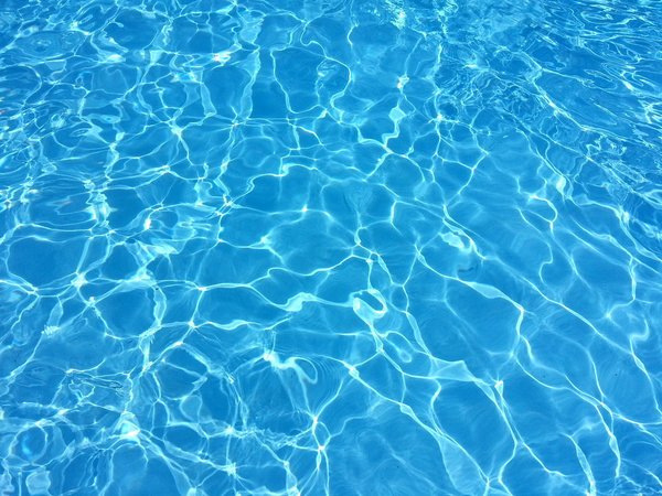 What are the best practices for maintaining water quality in a high-use UK home pool?